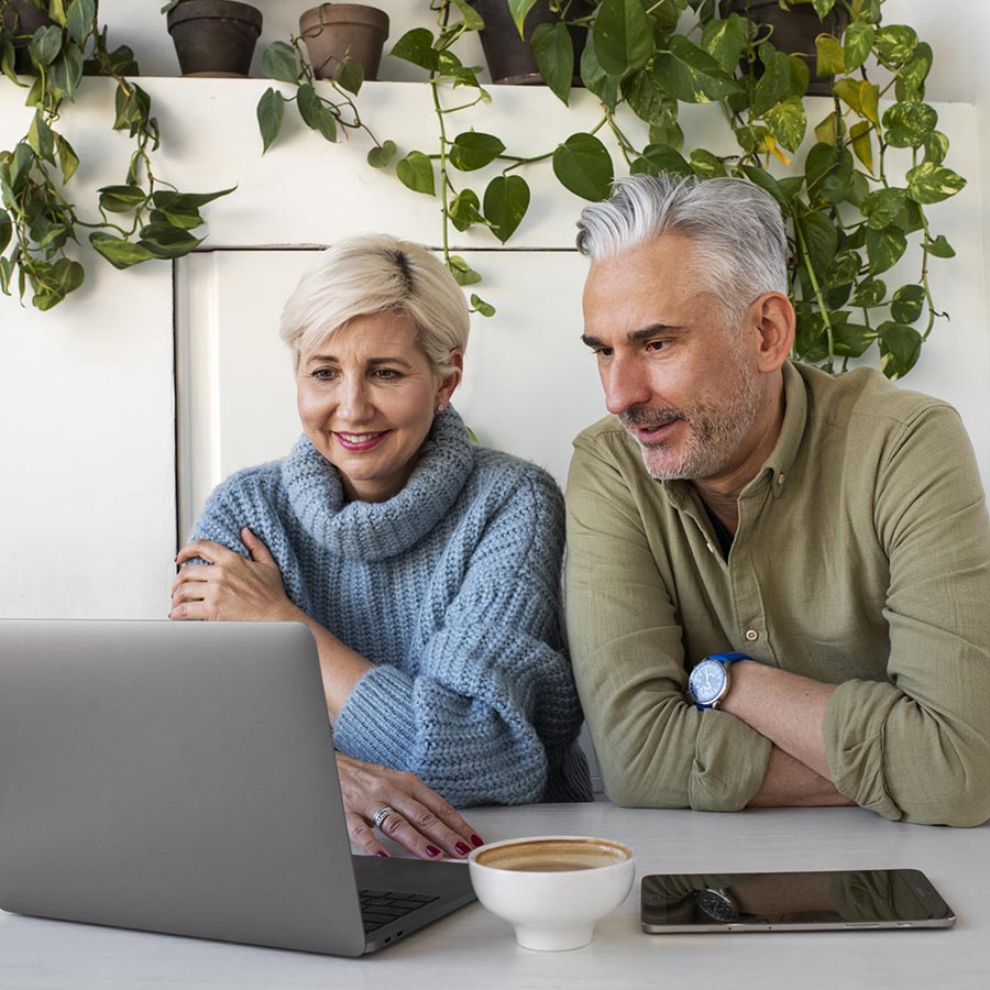 older-woman-home-talking-phone-while-having-coffee